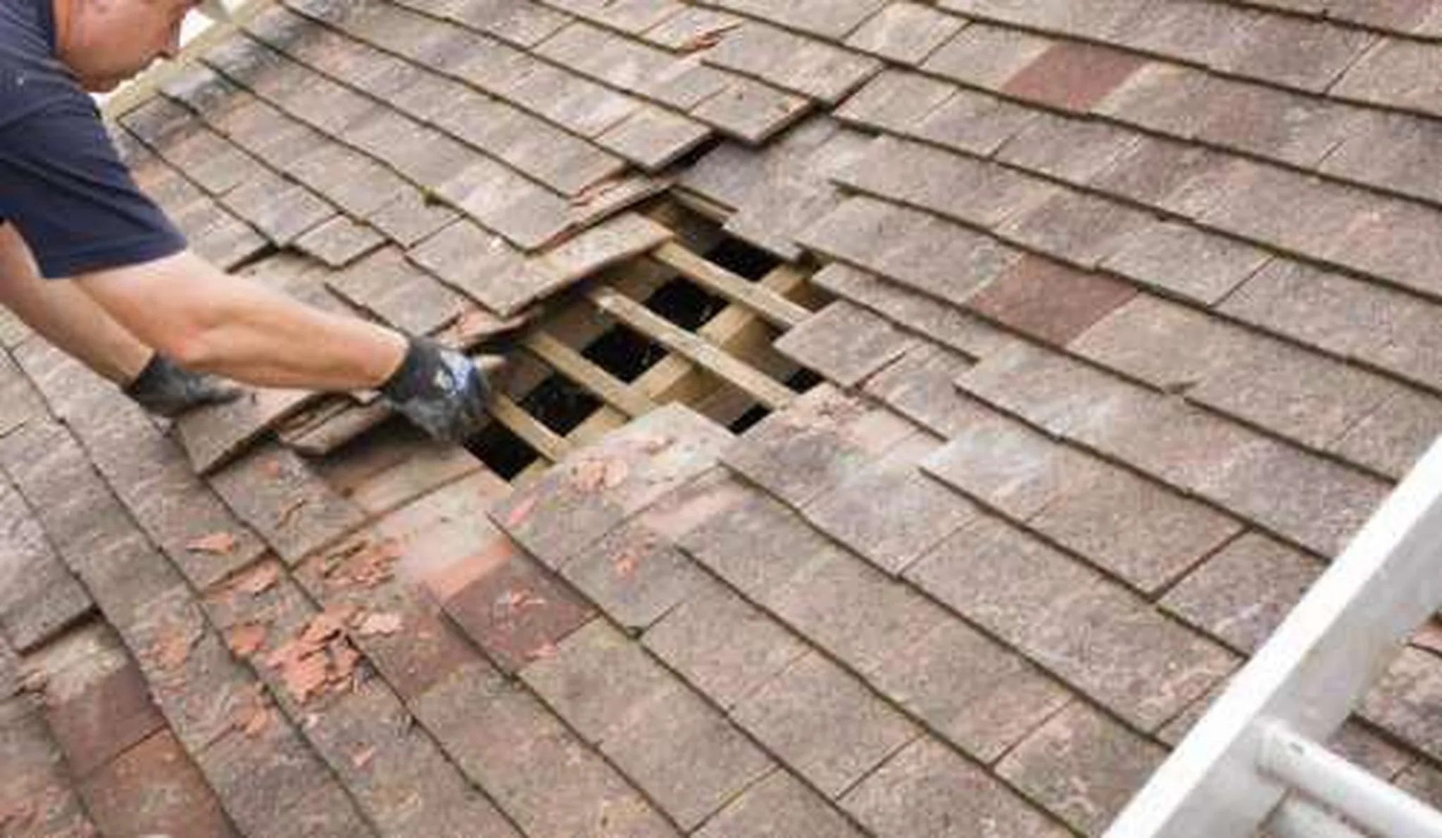 Roof shingle repair in progress